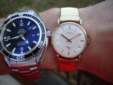 1994 Ford Bronco - Two wristwatches, an Omega and a Lord Elgin, are shown on a person's arm.