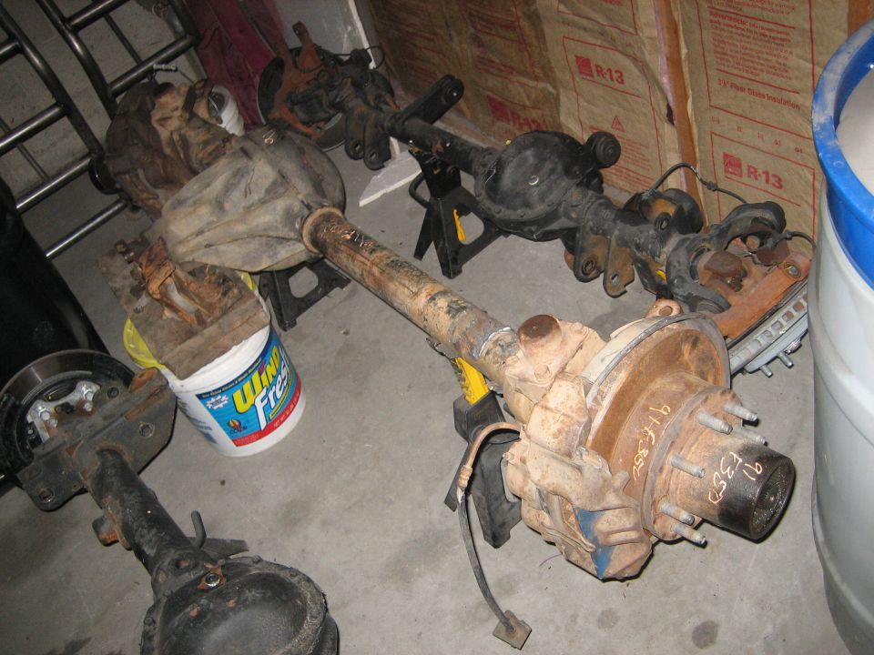 Multiple rear axles, one with "91 F350" written on it
