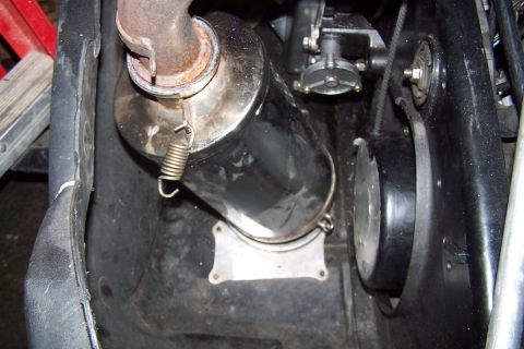 2004 Arctic Cat F-7 Firecat - Detail shot of the exhaust system and drive components on a snowmobile.