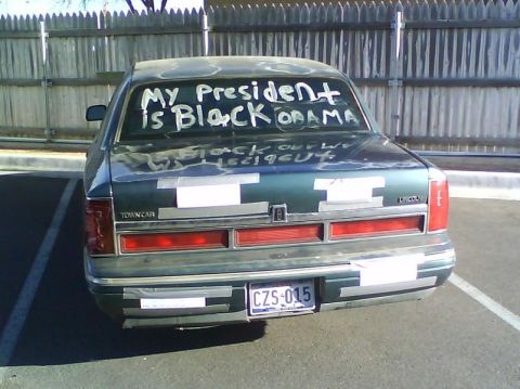 2000 Ford Crown Victoria - This Lincoln Town Car has a message written on its rear window.