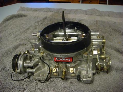 1975 Chevrolet Corvette - A close-up view of an Edelbrock carburetor, a common aftermarket performance part for vehicles.