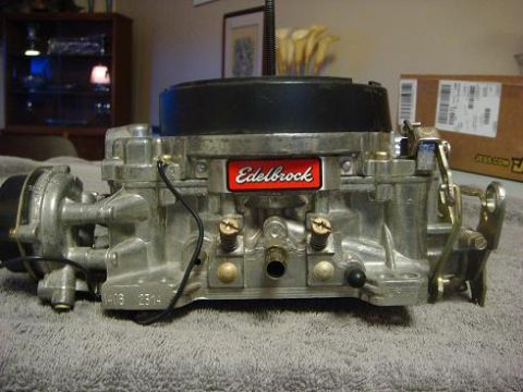 1975 Chevrolet Corvette - A close-up view of an Edelbrock carburetor, a component for a vehicle's engine.