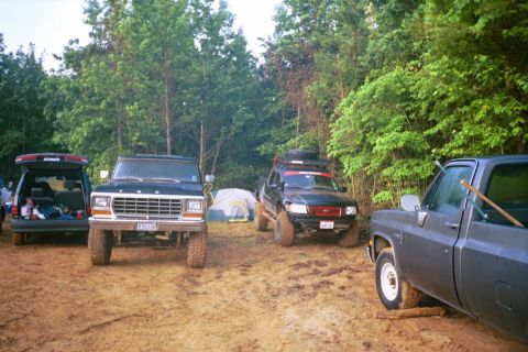 1979 Ford Bronco - A 1979 Ford Bronco is parked at a campsite with other vehicles and tents.