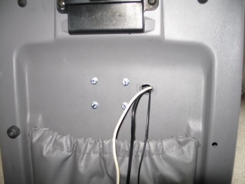 1995 Ford Bronco - Close-up of an interior panel showing wiring and a storage pouch.