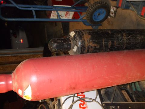 1996 Jeep Grand Cherokee - Two large gas cylinders are visible in the foreground, with a dolly in the background.
