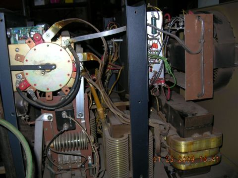 1997 Ford F-250 - Close-up view of the internal components of a welding machine, including a transformer, fan, and electrical wiring.