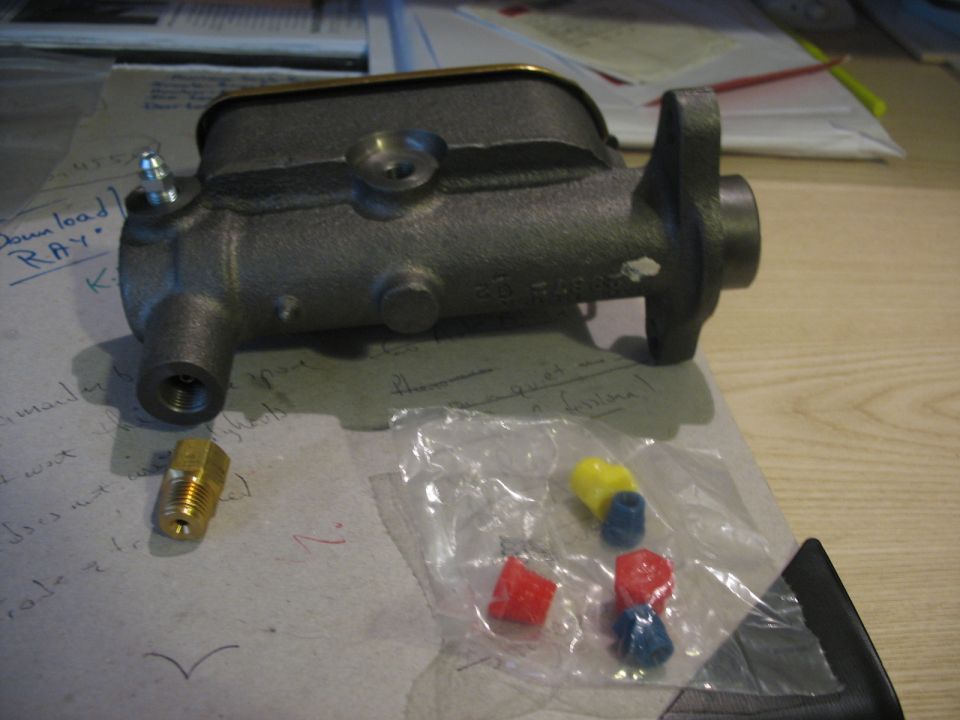 Master cylinder with brass fitting and colored caps