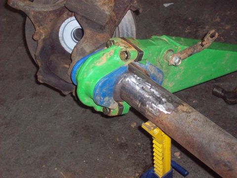 1978 Ford Bronco - Close-up of aftermarket suspension components being worked on, with a "Supermotors.net" watermark visible.