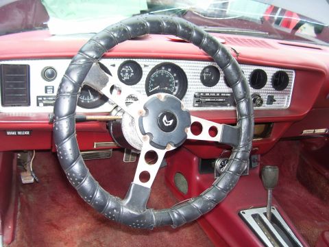 1978 Pontiac Trans Am - The interior of a 1978 Pontiac Trans Am shows the dashboard, steering wheel, and gear shifter.