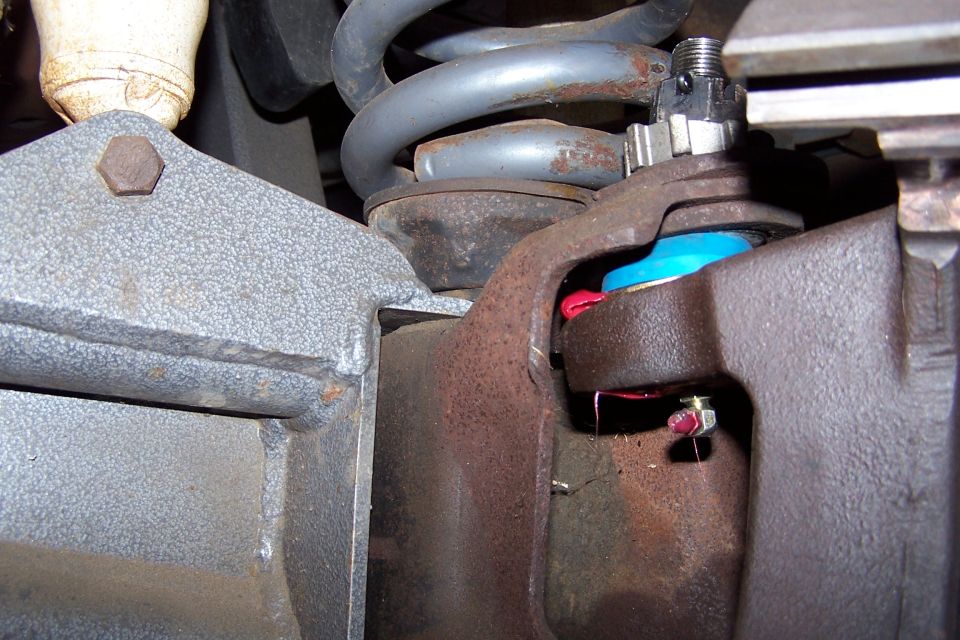 Ball joint assembly with blue boot and red grease