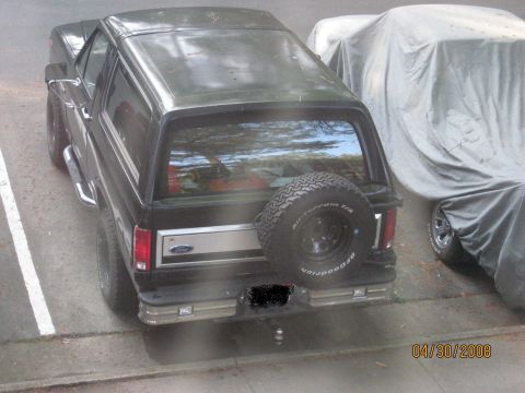 1986 Ford Bronco - Spare tire carrier repainted, mounted and in use.