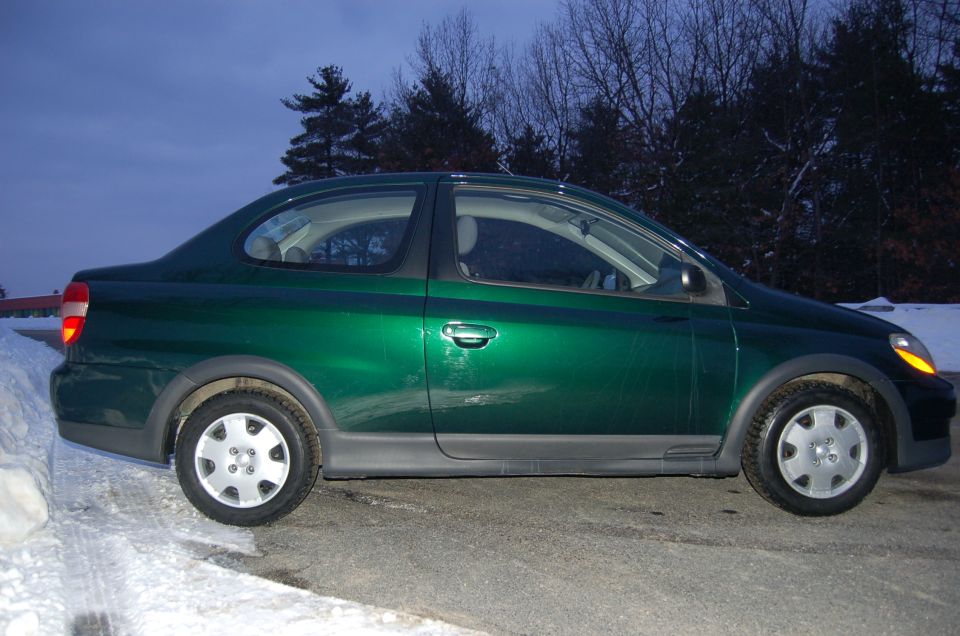 Green 2001 Toyota Echo sedan, side view