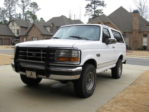 1996 Ford Bronco - Front 3/4 view of a white 1996 Ford Bronco with a black brush guard.