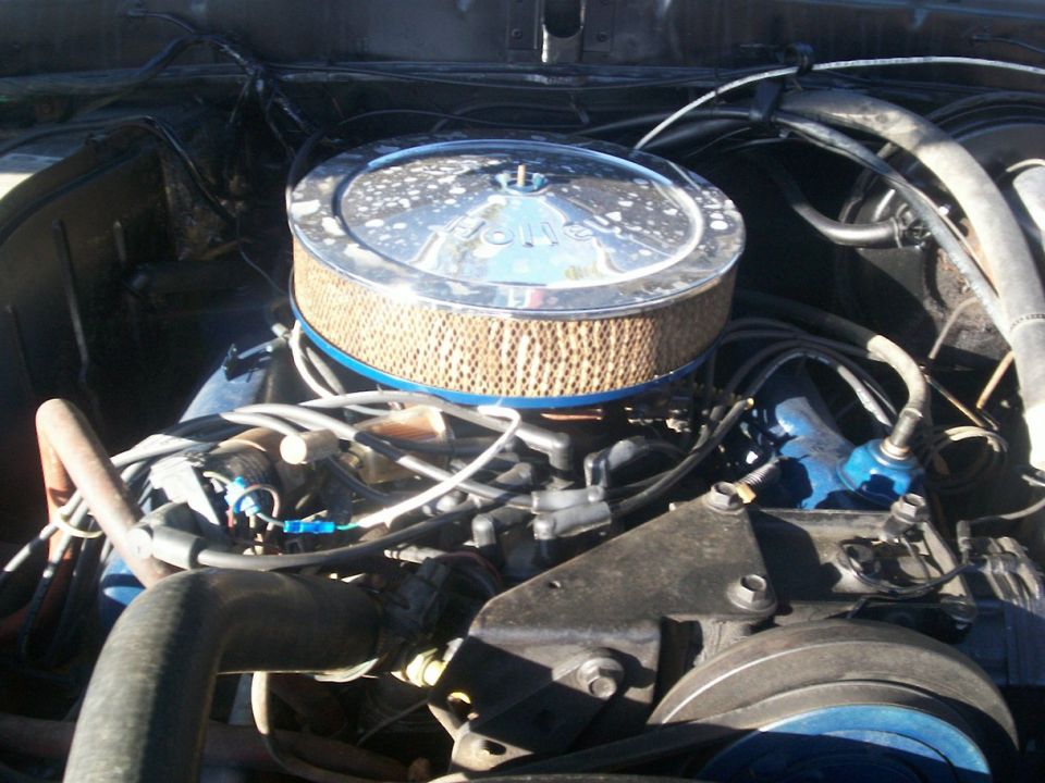 Chrome air cleaner assembly over engine components