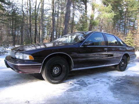 1991 Ford LTD Crown Victoria - A 1996 Chevrolet Caprice sedan is parked outside in a snowy, wooded environment.