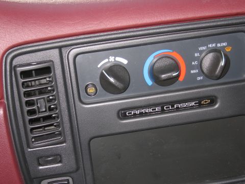 1991 Ford LTD Crown Victoria - The climate controls and 'Caprice Classic' badging are visible on the dashboard of this vehicle.