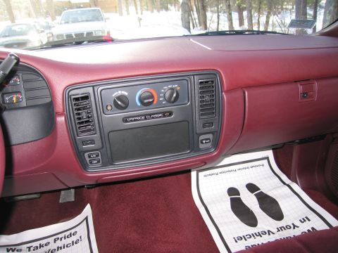 1991 Ford LTD Crown Victoria - Interior view of a 1994 Chevrolet Caprice Classic, highlighting the dashboard and floor mats.