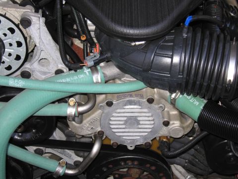 1991 Ford LTD Crown Victoria - Engine bay detail showing various parts and hoses, with a date stamp visible on one component.