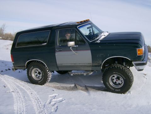 1990 Ford Bronco - This Ford Bronco is equipped with off-road tires and appears to be a later model than 1990.