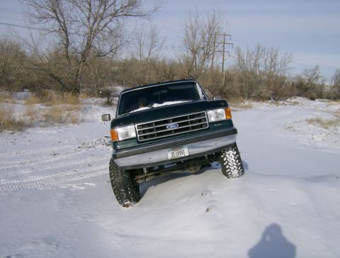 1990 Ford Bronco - This 1990 Ford Bronco navigates a snowy terrain, its off-road capabilities.