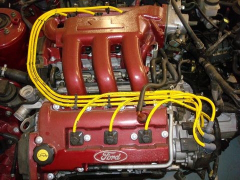 1994 Ford Probe - Close-up of a Ford engine, showing the intake manifold and spark plug wires.