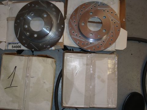 1994 Ford Probe - Two new brake rotors are shown, packaged and ready for installation.