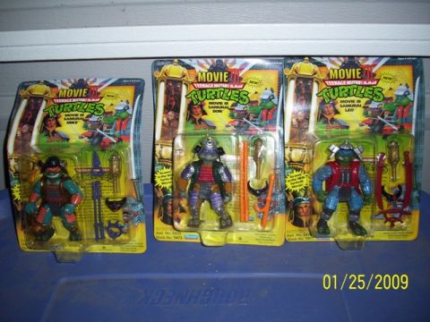 1991 Ford Bronco - Packaged action figures of Michelangelo, Donatello as Samurai, and Leonardo from Teenage Mutant Ninja Turtles III.