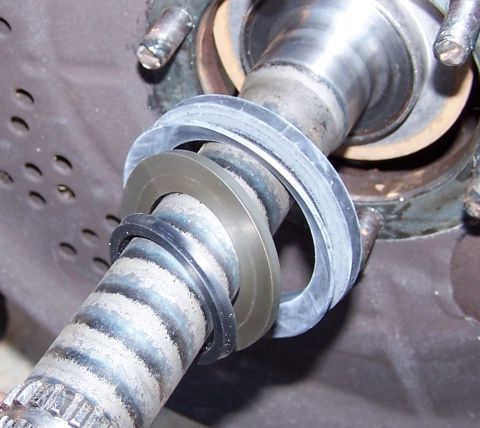 1990 Ford Bronco - This image shows a close-up view of several seals and washers on a splined shaft, likely part of a vehicle's suspension system.