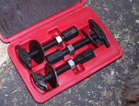1990 Ford Bronco - Ball joint press tool kit with three threaded rods, nuts, and T-handles in a red case.