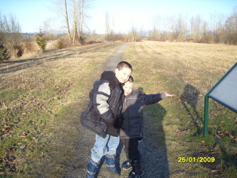 1989 Ford Bronco - Two boys pose for a photo on a path in a field on a sunny day.