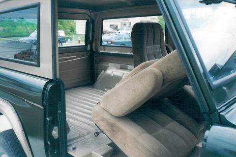 1975 Ford Bronco - Even with a tilting & sliding base, there's still not much access to the back. You can see the rear defrost grid, especially thru the side…