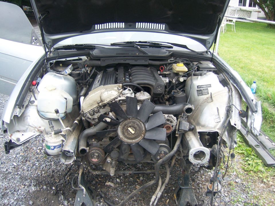 BMW inline-six engine bay with front end stripped and fan clutch exposed