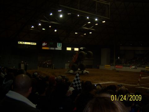 1996 Ford Bronco - A monster truck performs a stunt over a crushed car in an indoor arena on January 24, 2009.