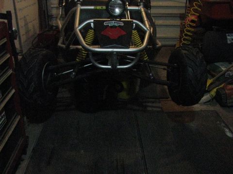 2006 Ford F1 - A go-kart with a prominent "Grave Digger" logo is viewed from the front.