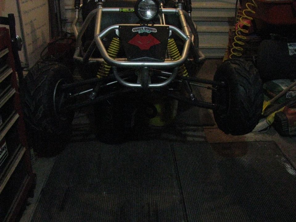 Go-kart with yellow springs and a "Grave Digger" logo on the front