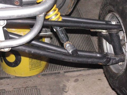 2006 Ford F1 - The front suspension system of a go-kart, A-arms and a shock absorber, is shown in detail.