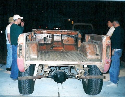 1975 Ford Bronco - The neighbor kids who were foolish enough to come by & gawk are now being suckered into lifting the body.