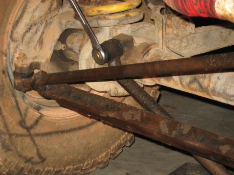 1978 Ford Bronco - A wrench is used to adjust a component of the vehicle's suspension system.