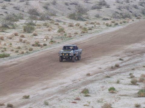 1994 Ford Bronco - This modified truck is built for off-road racing, kicking up dust on a desert course.