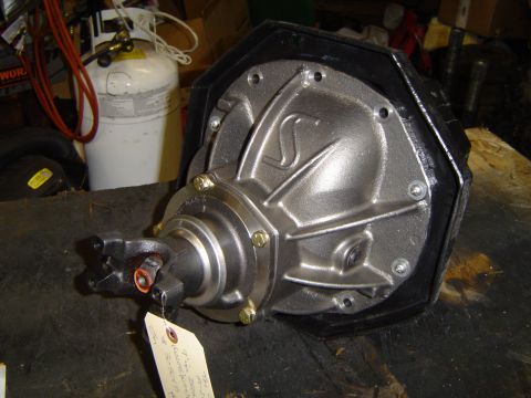 1989 Ford Bronco - Close-up of a differential housing and driveshaft yoke, likely a vehicle part.