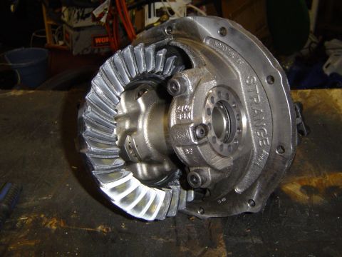 1989 Ford Bronco - Close-up of a differential assembly, showing the ring and pinion gears. The "STRANGE" brand is visible.