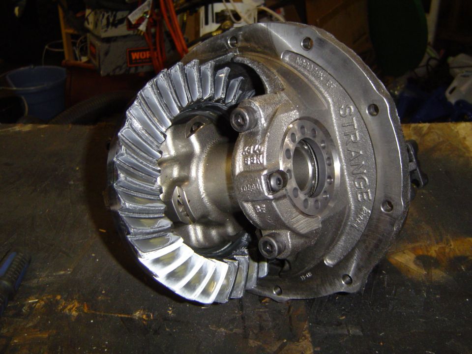 Differential assembly with large ring gear and pinion gear, labeled STRANGE