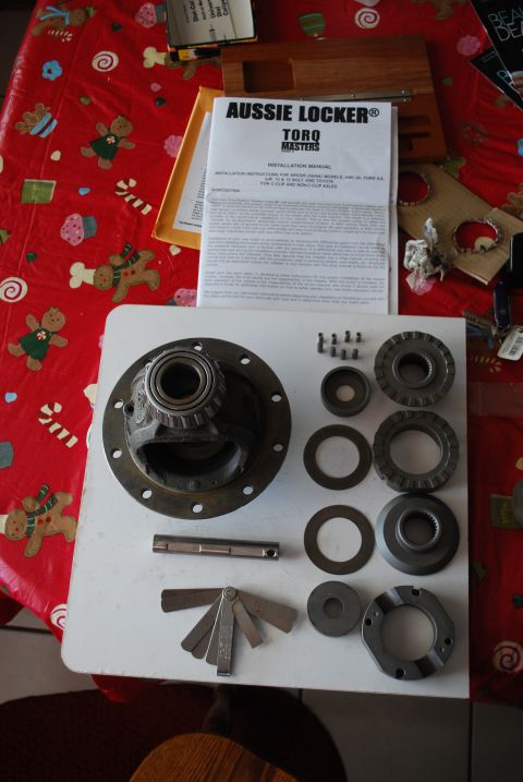 1996 Ford Bronco - Installation manual and parts for an Aussie Locker differential are laid out on a table.