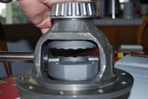 1996 Ford Bronco - A differential carrier with a bearing and gear teeth is held by a hand, with a Supermotors.net logo visible.