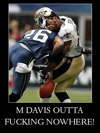 2000 Mercury Grand Marquis - A football player is tackled during a game. The image has text overlay and a website address at the bottom.