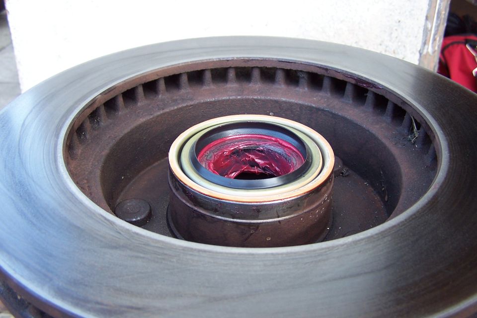 Wheel bearing assembly with red grease packed inside