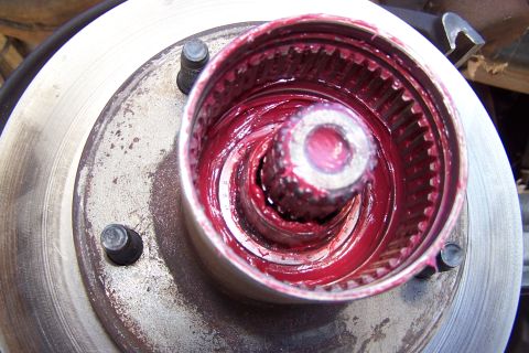 1990 Ford Bronco - This image shows a greased wheel hub assembly, likely for maintenance or repair.