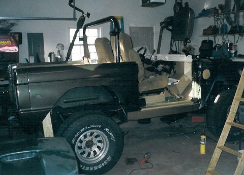 1975 Ford Bronco - The rear section of the roll cage is going back in (unfortunately) to support the shoulder belts, and the '86 EB Bronco seats have been fit…