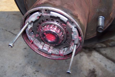1990 Ford Bronco - Detail of a greased wheel hub assembly, showing internal splines and locking mechanism components.