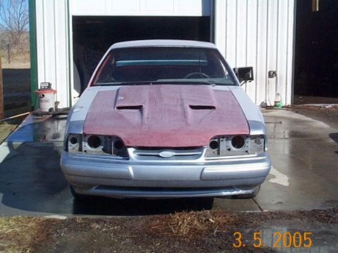 1983 Mercury Capri - This car appears to be a Ford Mustang, not a 1983 Mercury Capri, and is undergoing some bodywork.